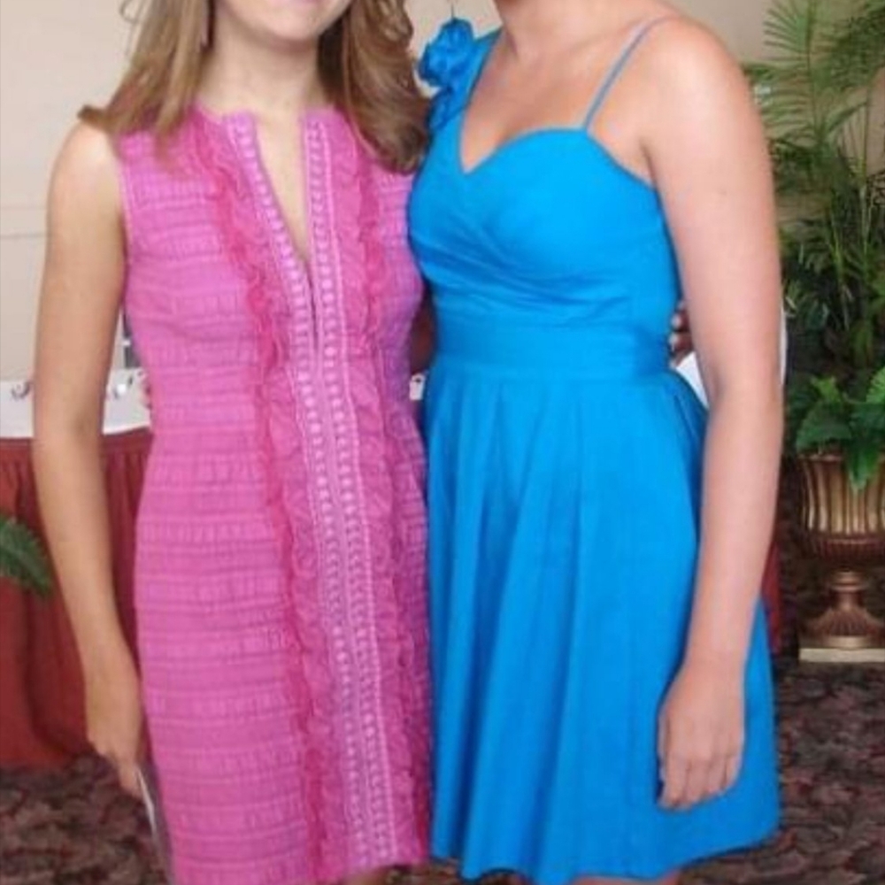 Blue cocktail dress with rose embellishment